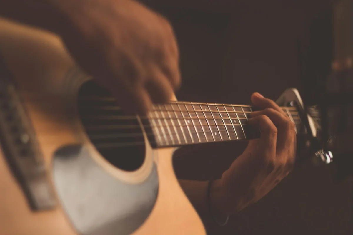 Performer with acoustic guitar